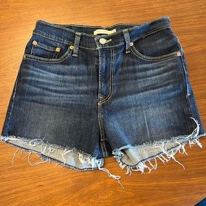 High Rise Levi Shorts in dark denim size 29.